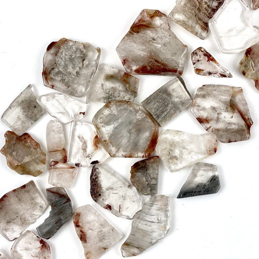 1/2 Lb Amphibolite Quartz Tumbled Slabs on a white background