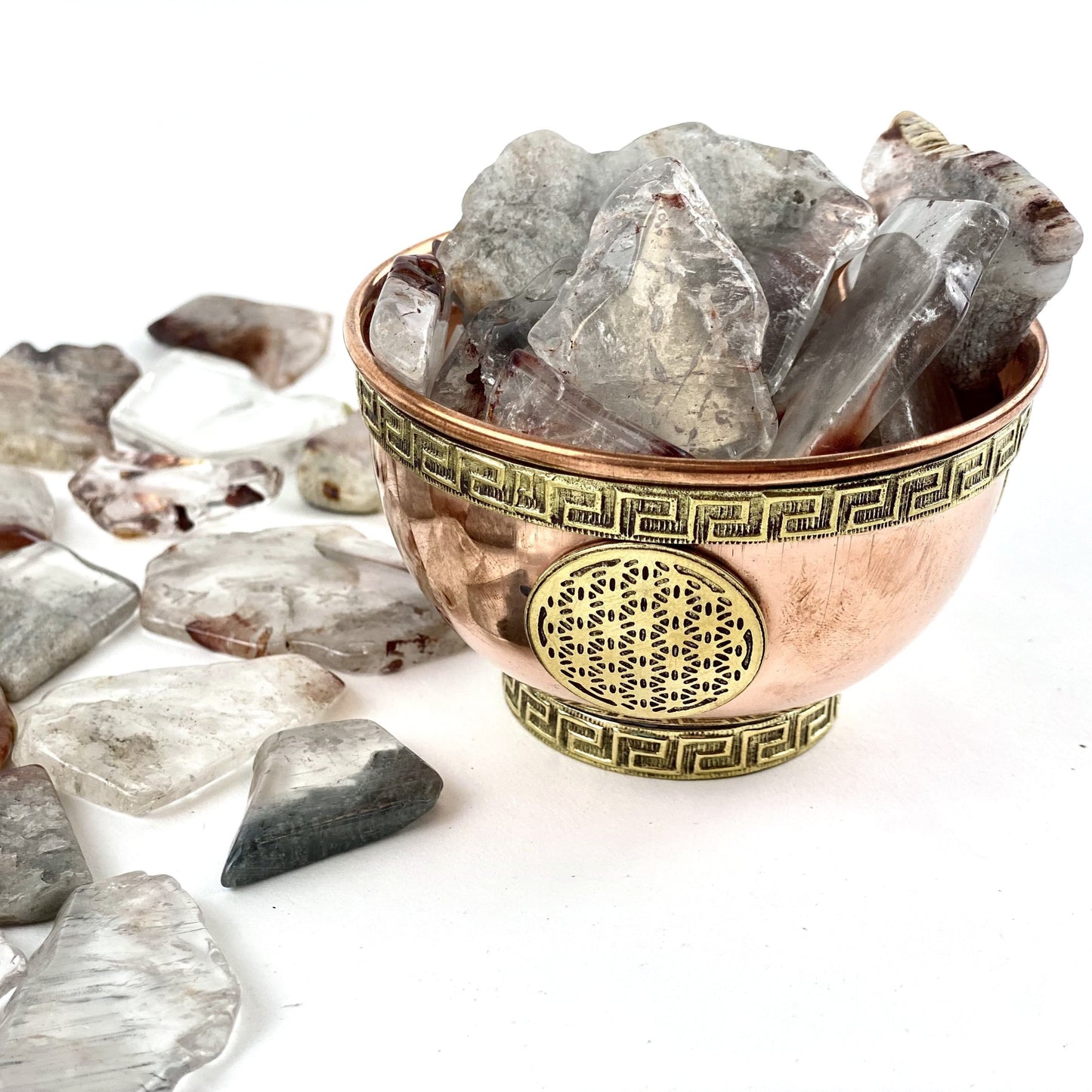 SIde angle view 1/2 Lb Amphibolite Quartz Tumbled Slabs in bowl (bowl not included)