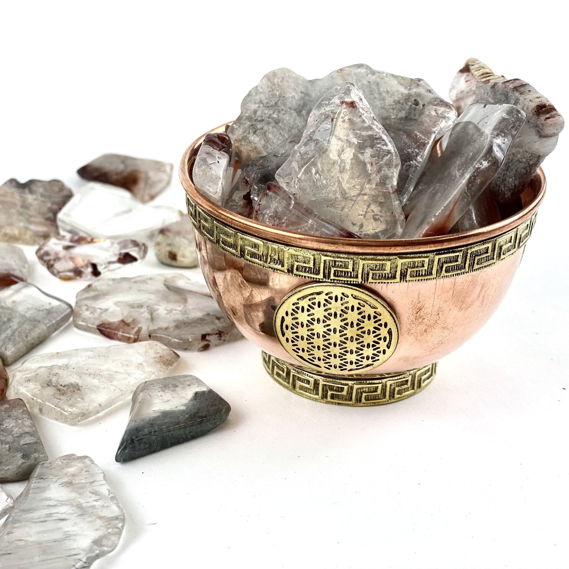 SIde angle view 1/2 Lb Amphibolite Quartz Tumbled Slabs in bowl (bowl not included)