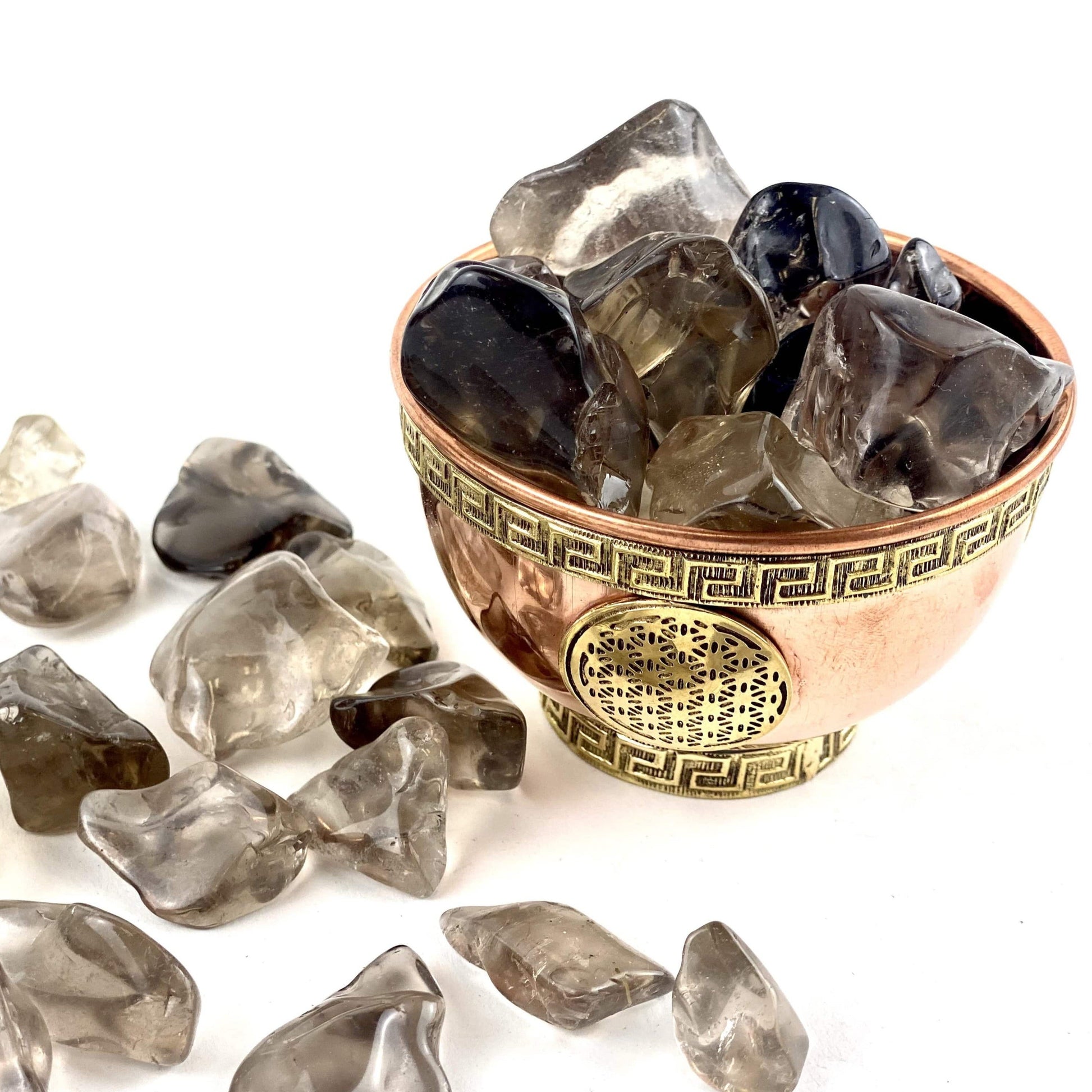 Smokey Quartz Small Tumbled Stones in a bowl and spread on a table