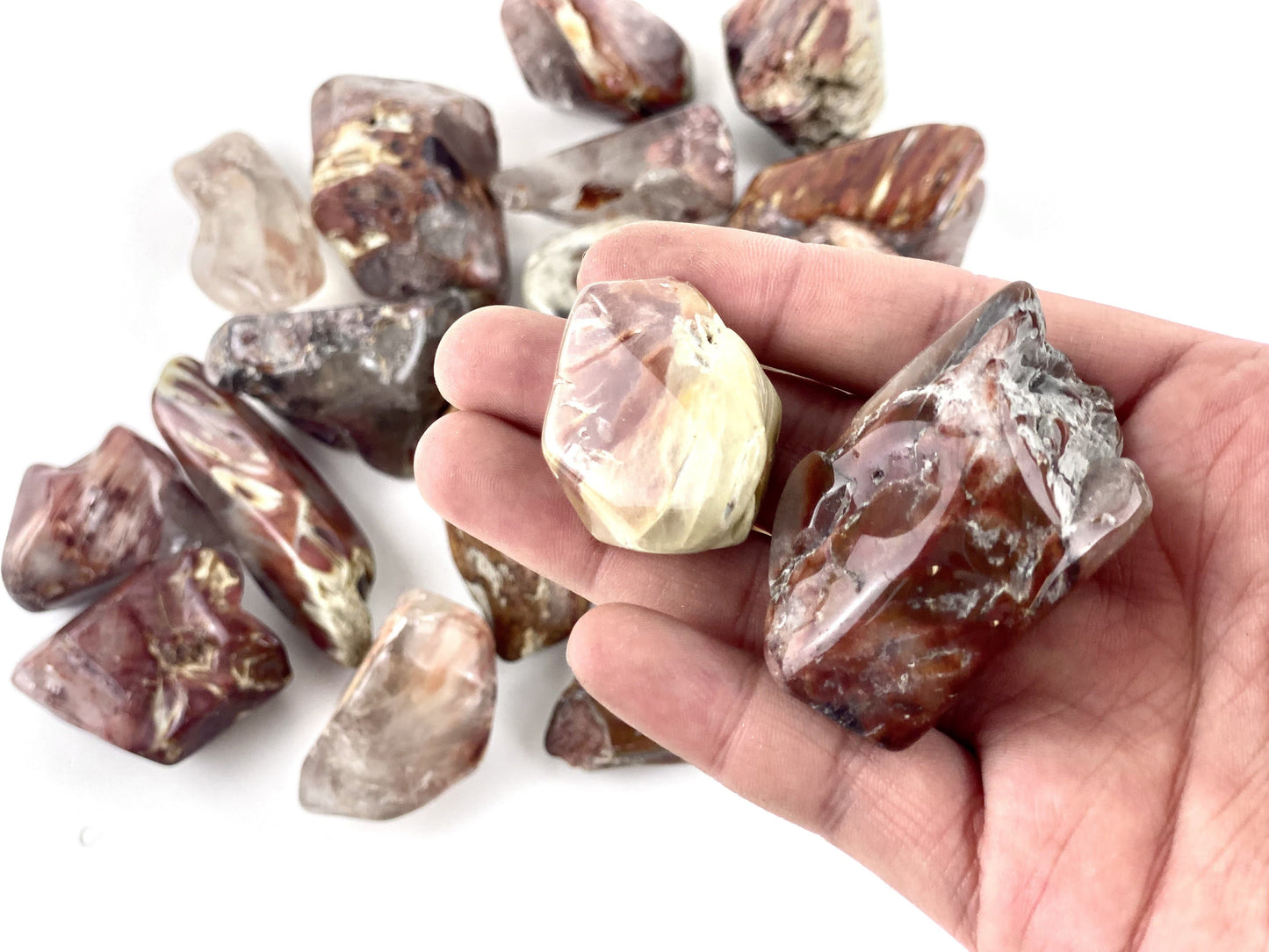 tumbled stones in hand for size reference 