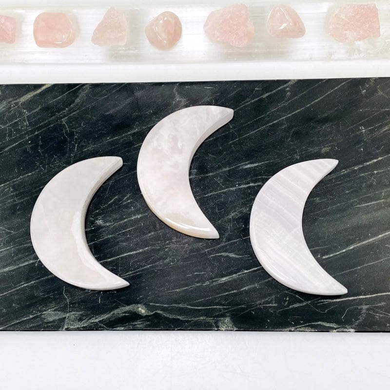 multiple pink calcite moons showing the different patterns 