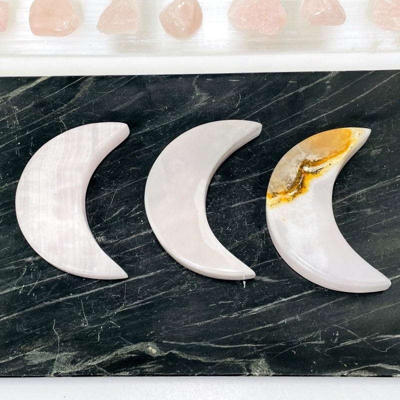 multiple pink calcite moons showing the different patterns