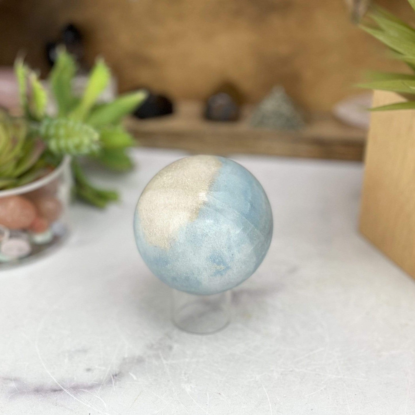 Trolleite Sphere with decorations in the background
