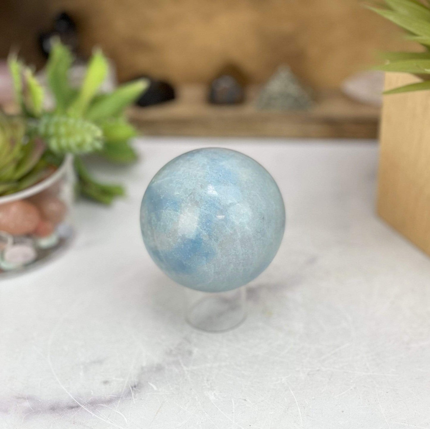 Trolleite Sphere with decorations in the background