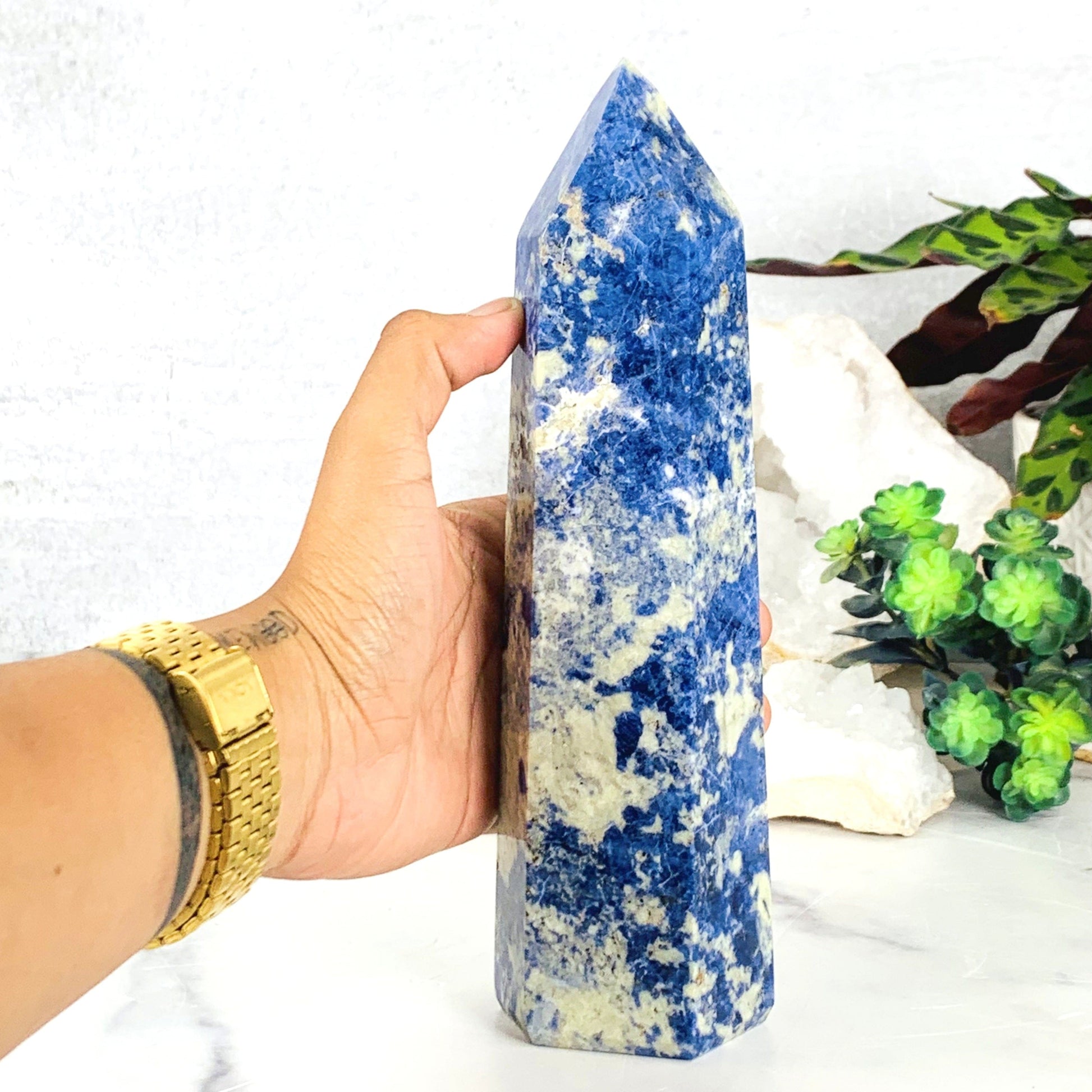 Hand comparing size to the Sodalite Polished Tower Point