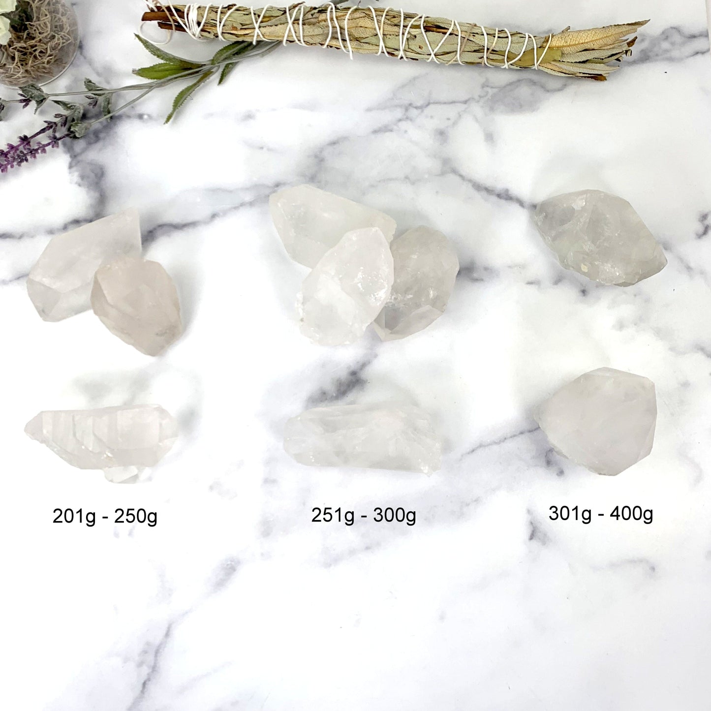 lemurian points next to their sizes. available in 201-250g, 251-300g and 301-400g