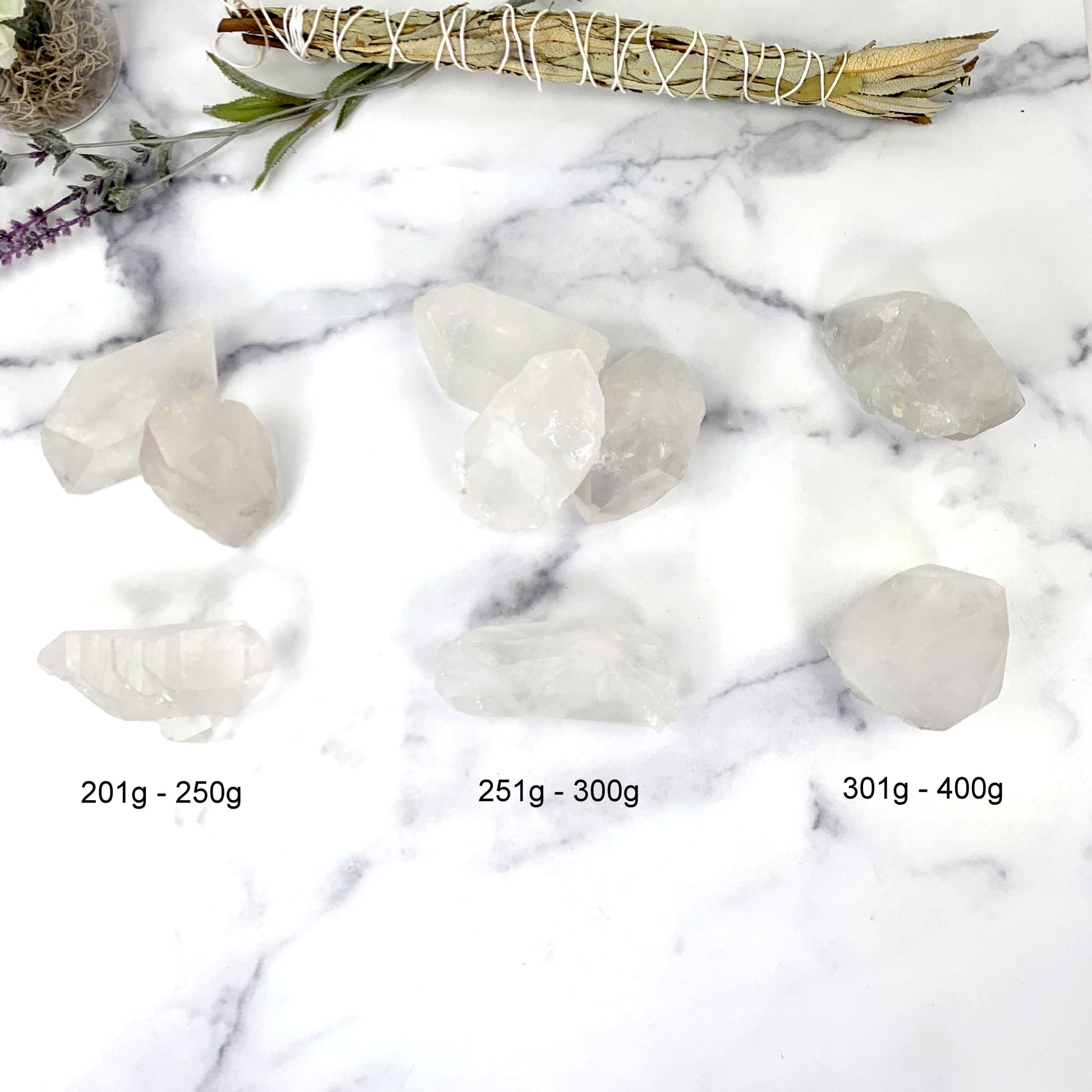 lemurian points next to their sizes. available in 201-250g, 251-300g and 301-400g