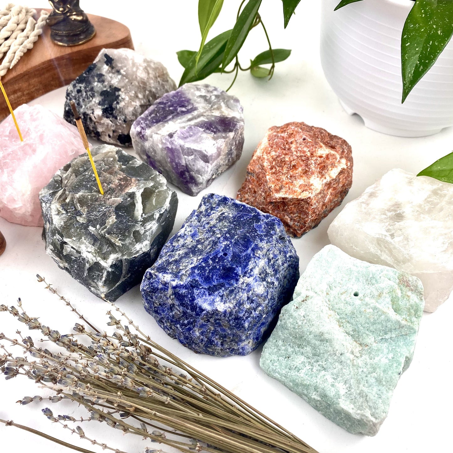 Angled shot of 8 Rough Stone Incense Burners with decorations around them