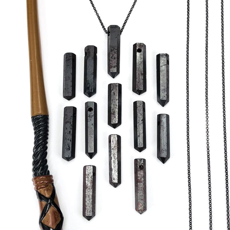 multiple hematite top drilled beads displayed showing the differences in sizes 