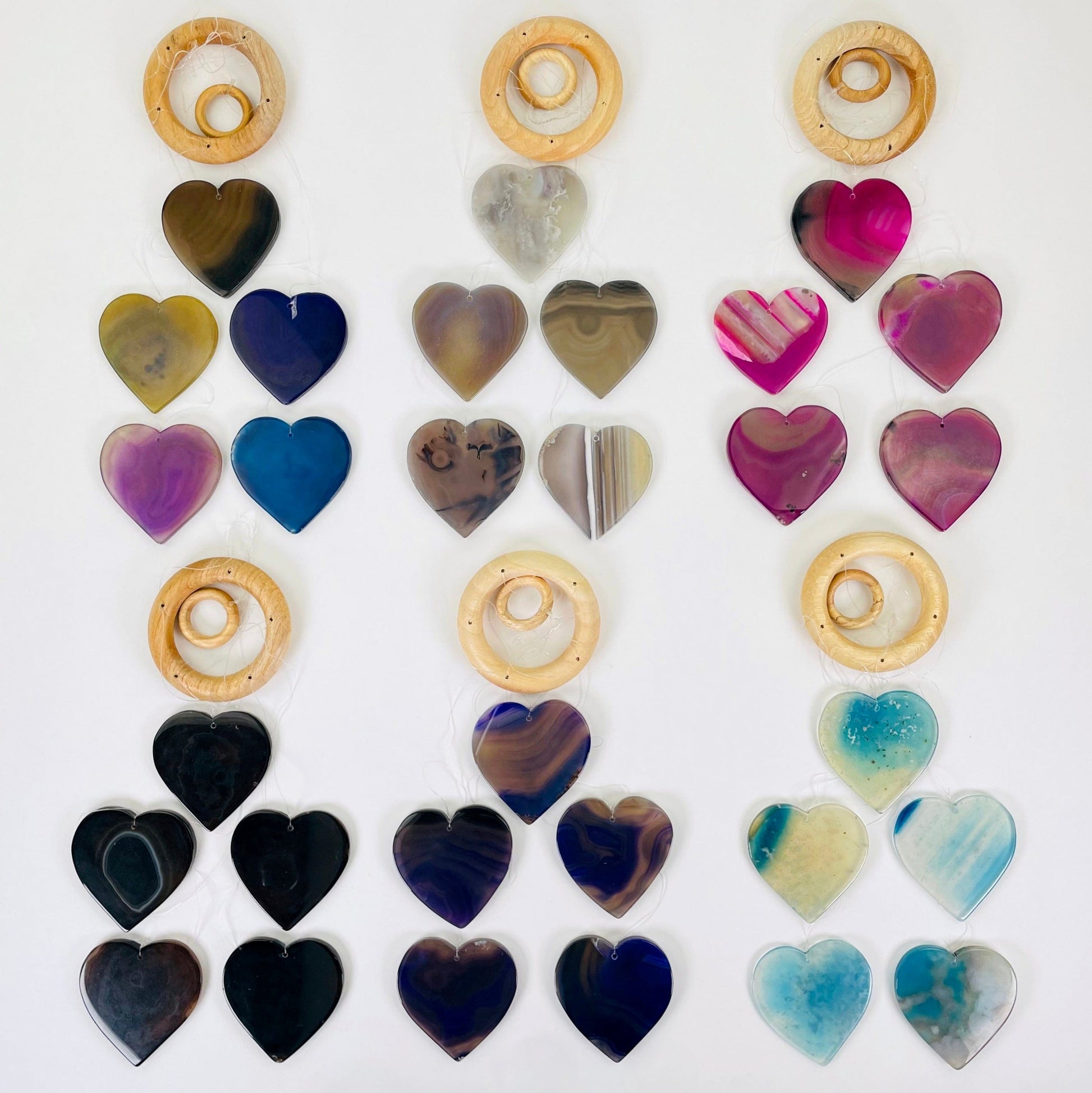 one of each agate heart wind chime options laying flat on white background