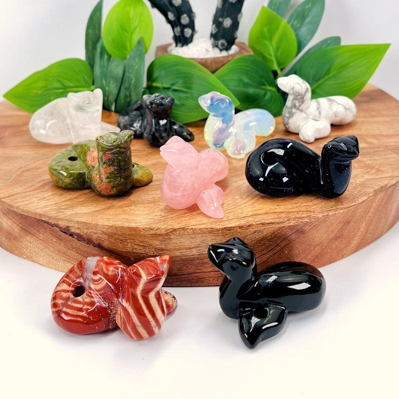 multiple gemstone snakes displayed to show the differences in the stone types