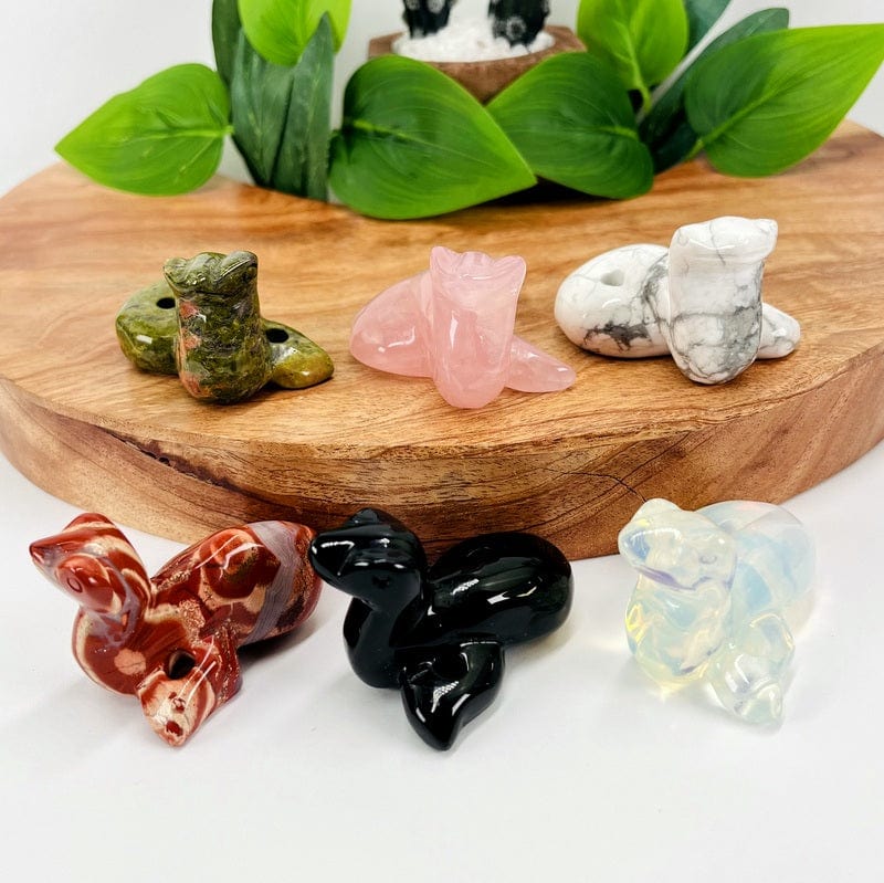 gemstone snakes displayed in different angles to show depth and thickness 