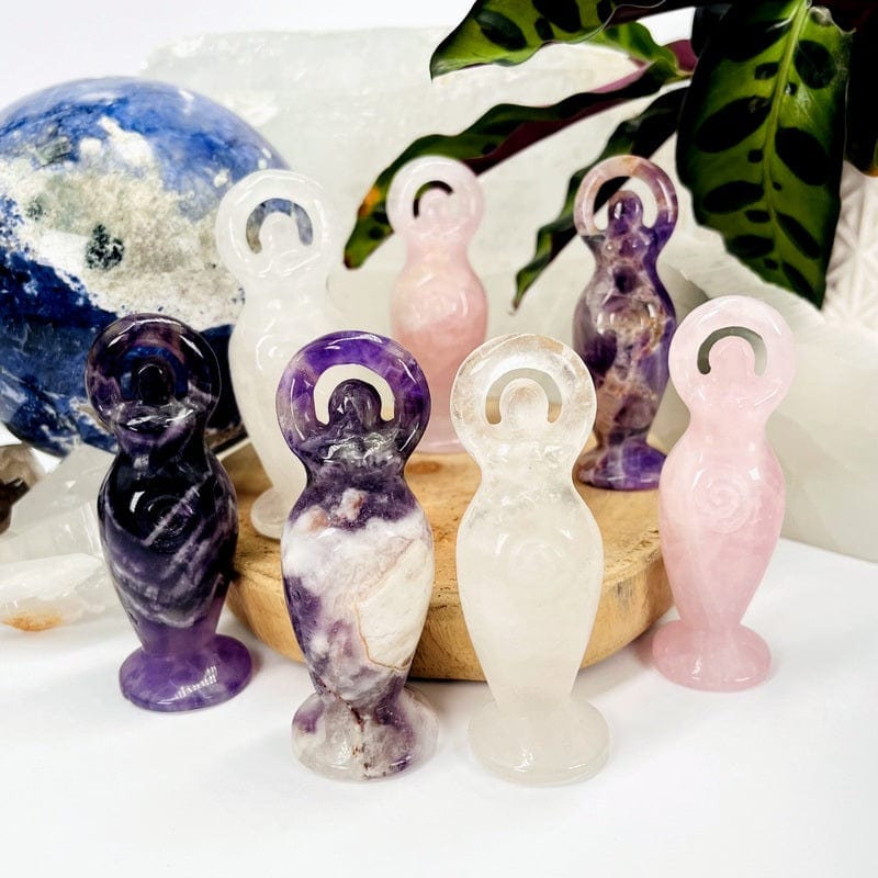 multiple earth goddess stand up gemstones displayed to show the differences in the stones and color shades 