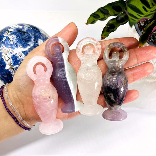 multiple gemstone earth goddesses in hand for size reference 