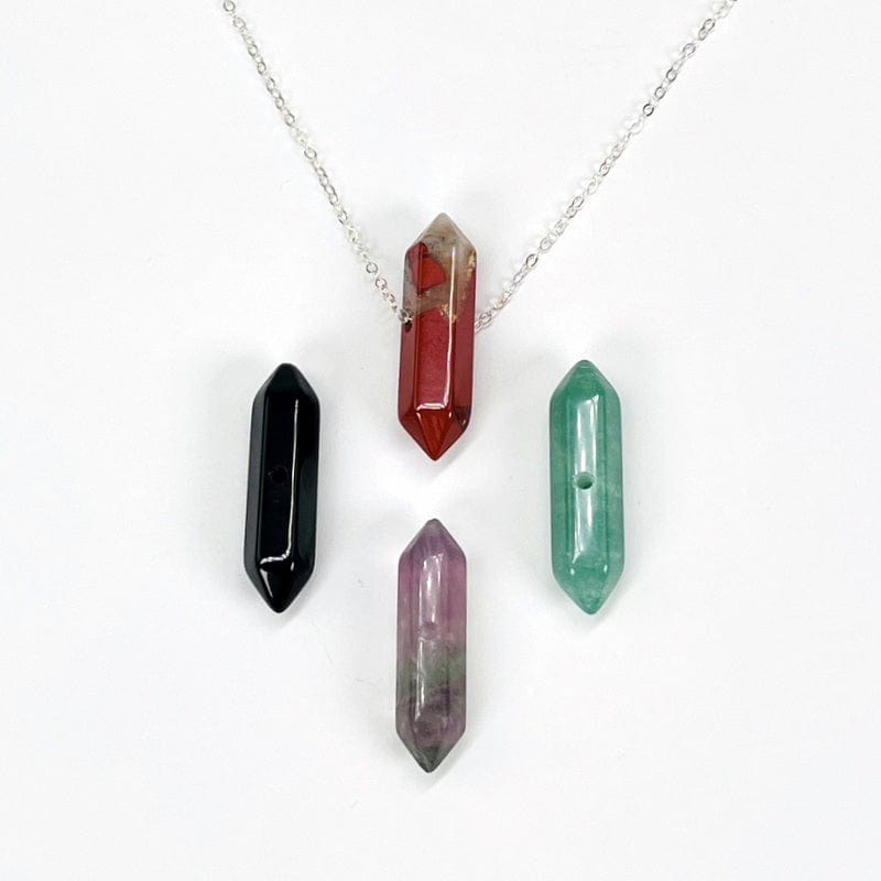 double terminated pencil point bead displayed on a silver chain 