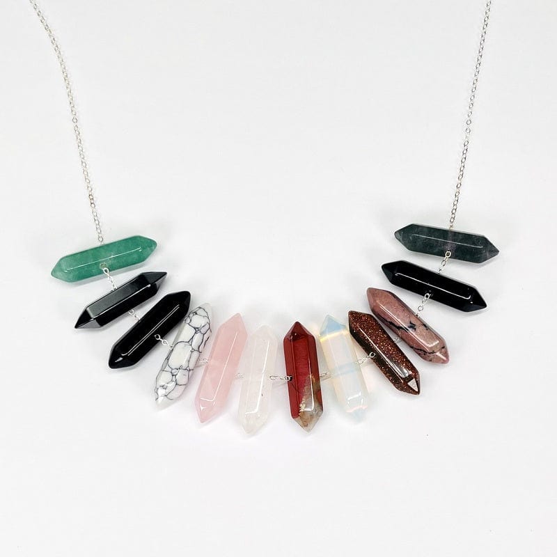 double terminated pencil point beads displayed on silver chain. chain not included 