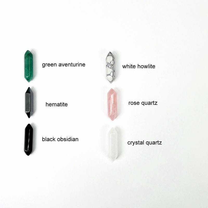 double terminated pencil points next to their stone name. available in green aventurine, hematite, black obsidian, white howlite, rose quartz and crystal quartz 