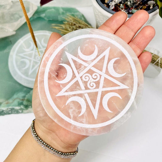selenite incense holder in hand for size reference 