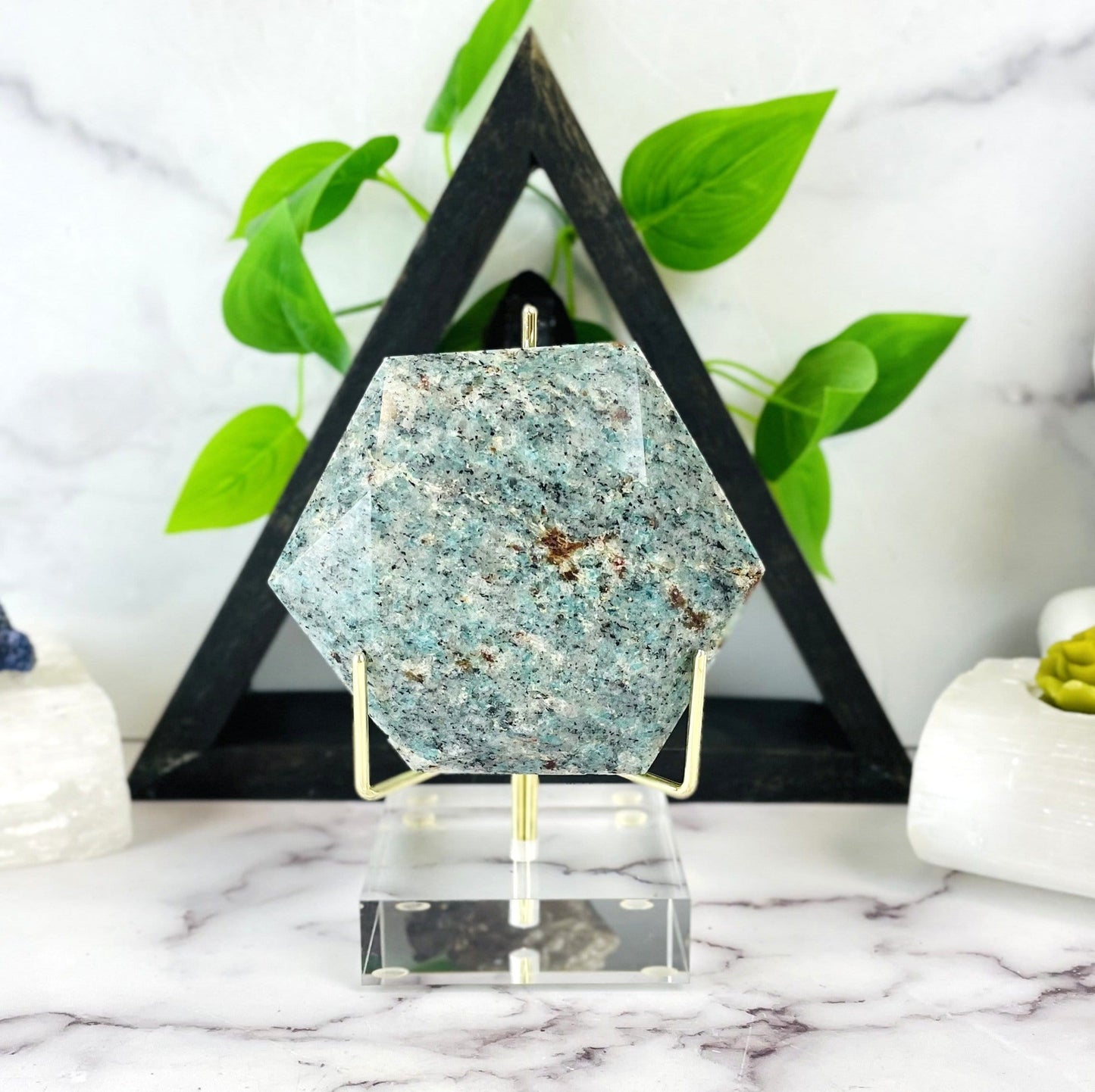hexagon is being displayed on an acrylic stand.