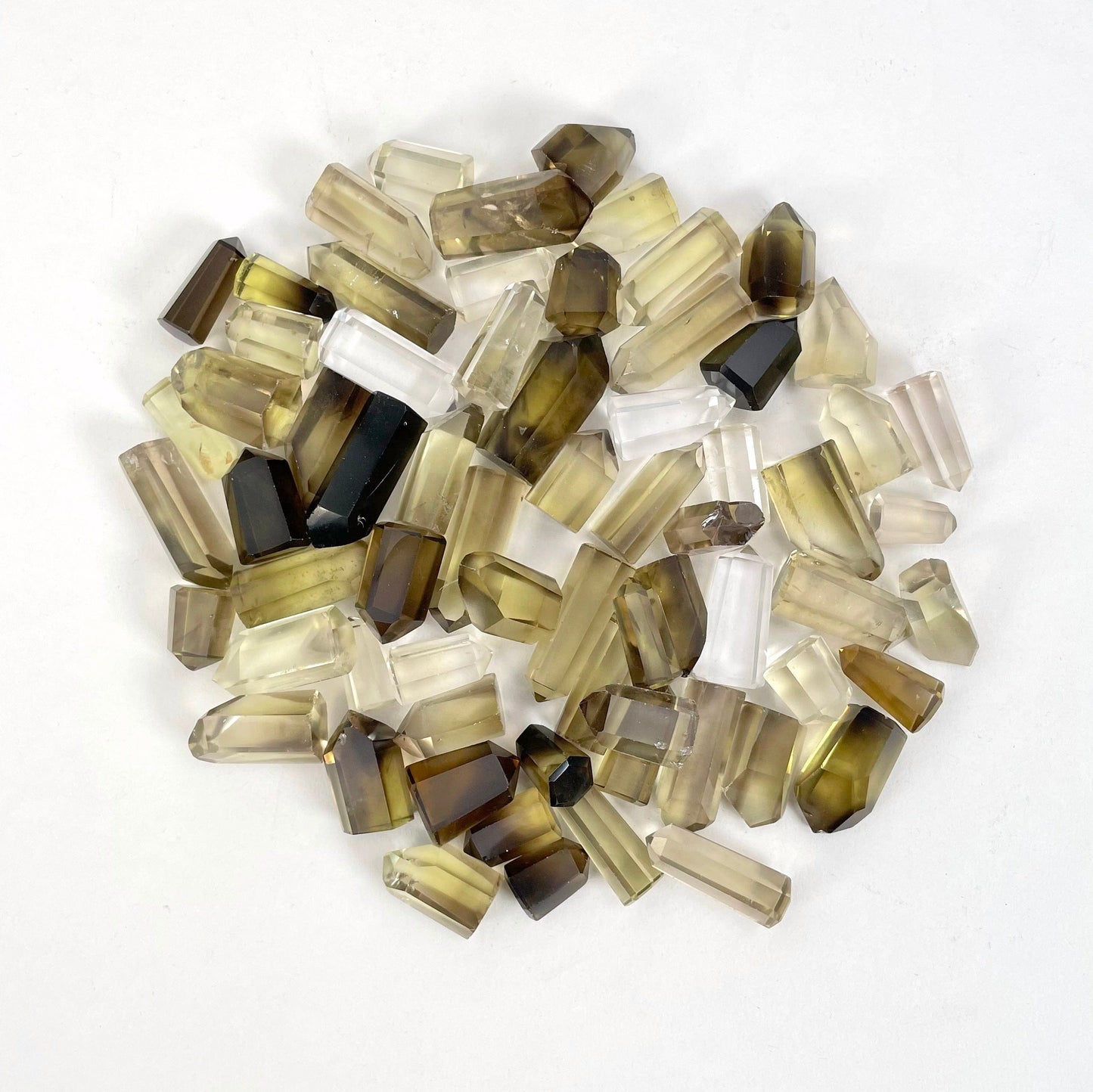 Natural Citrine Points on a white background.