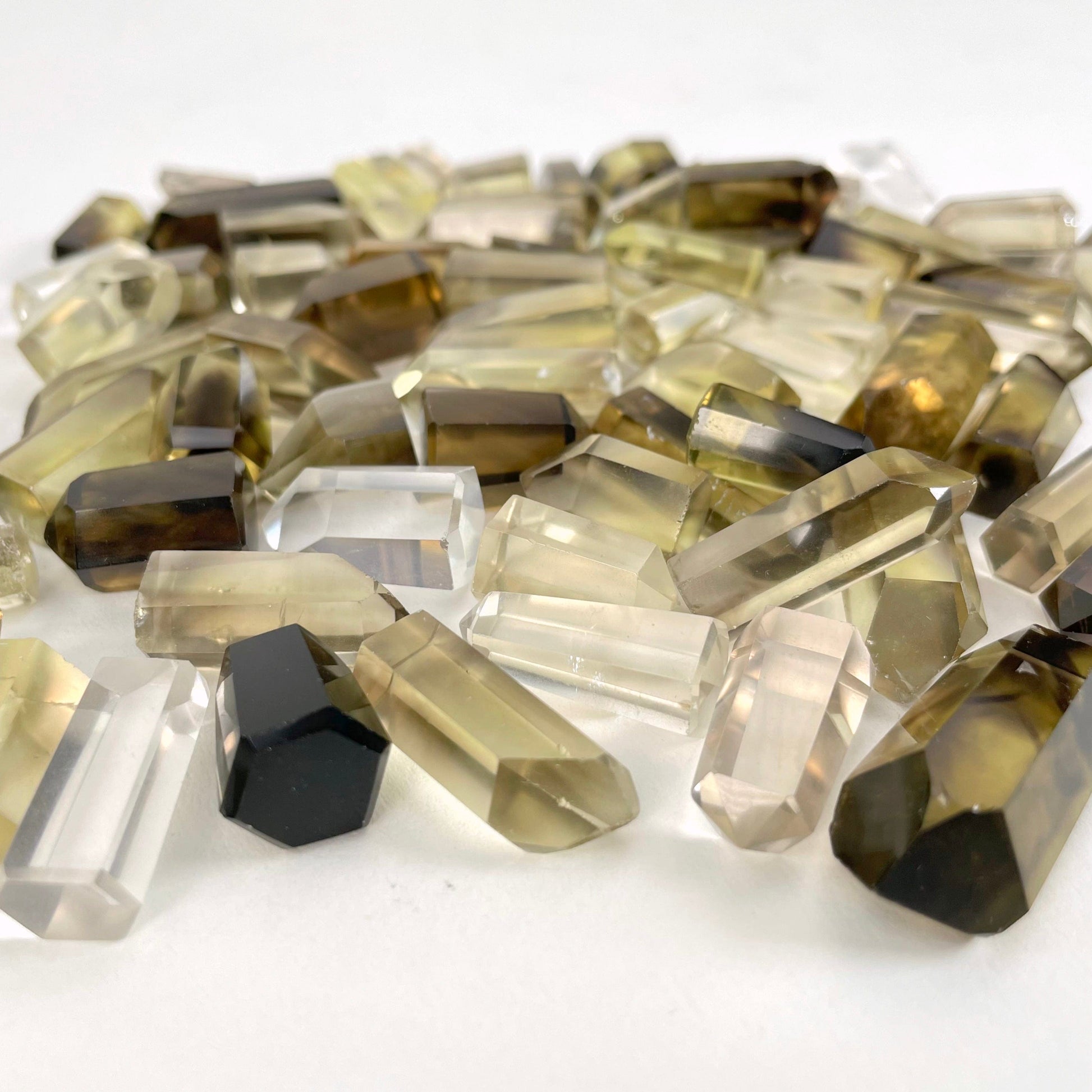 Natural Citrine Points on a white background.