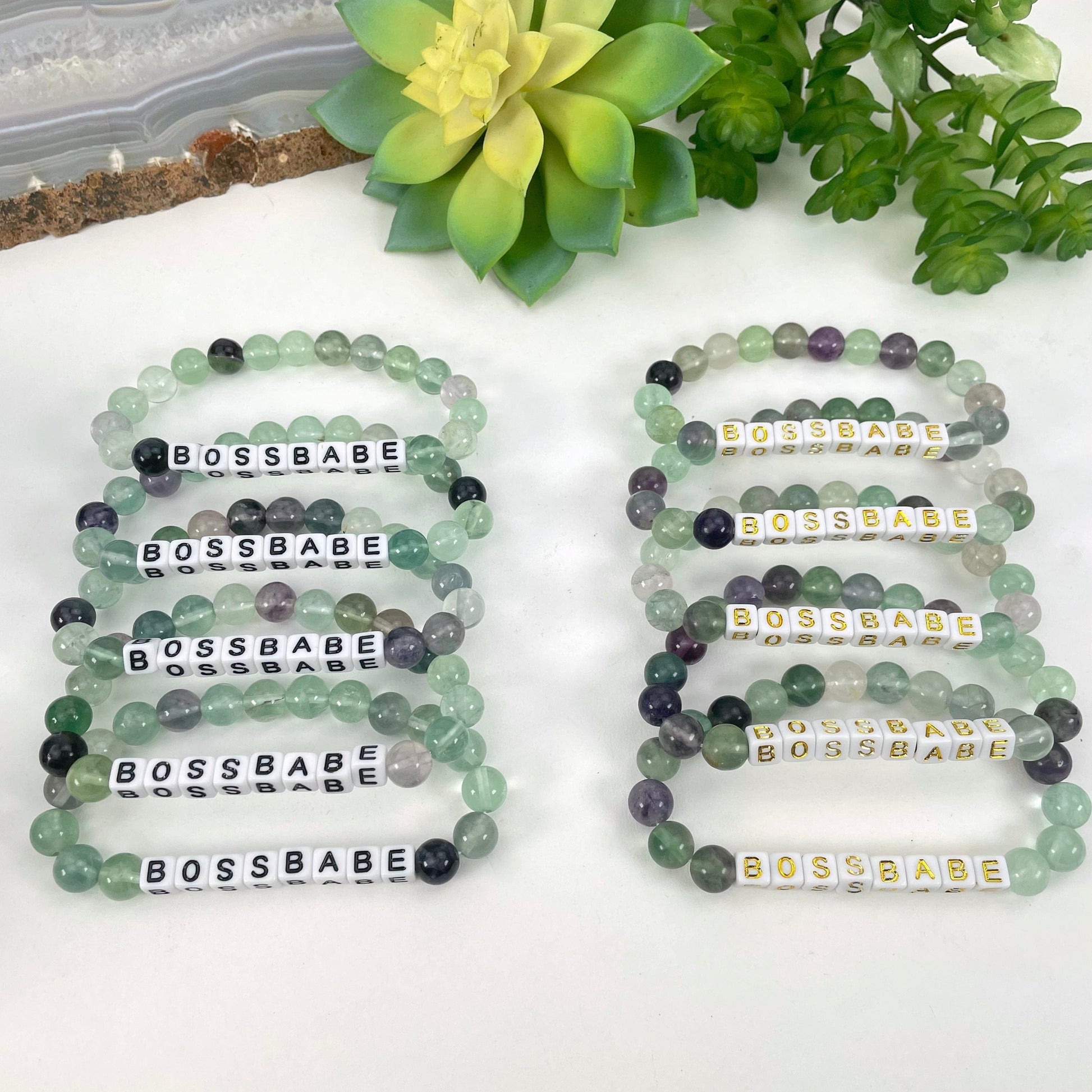 black "BOSSBABE" letter bead option on left display and gold "BOSSBABE" letter bead option on right display