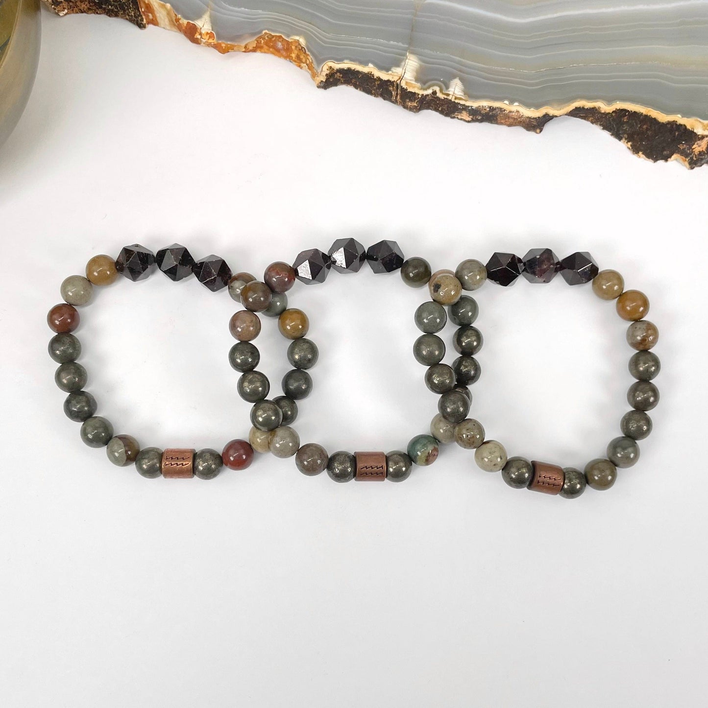 close up of aquarius zodiac bracelets for details and possible variations 