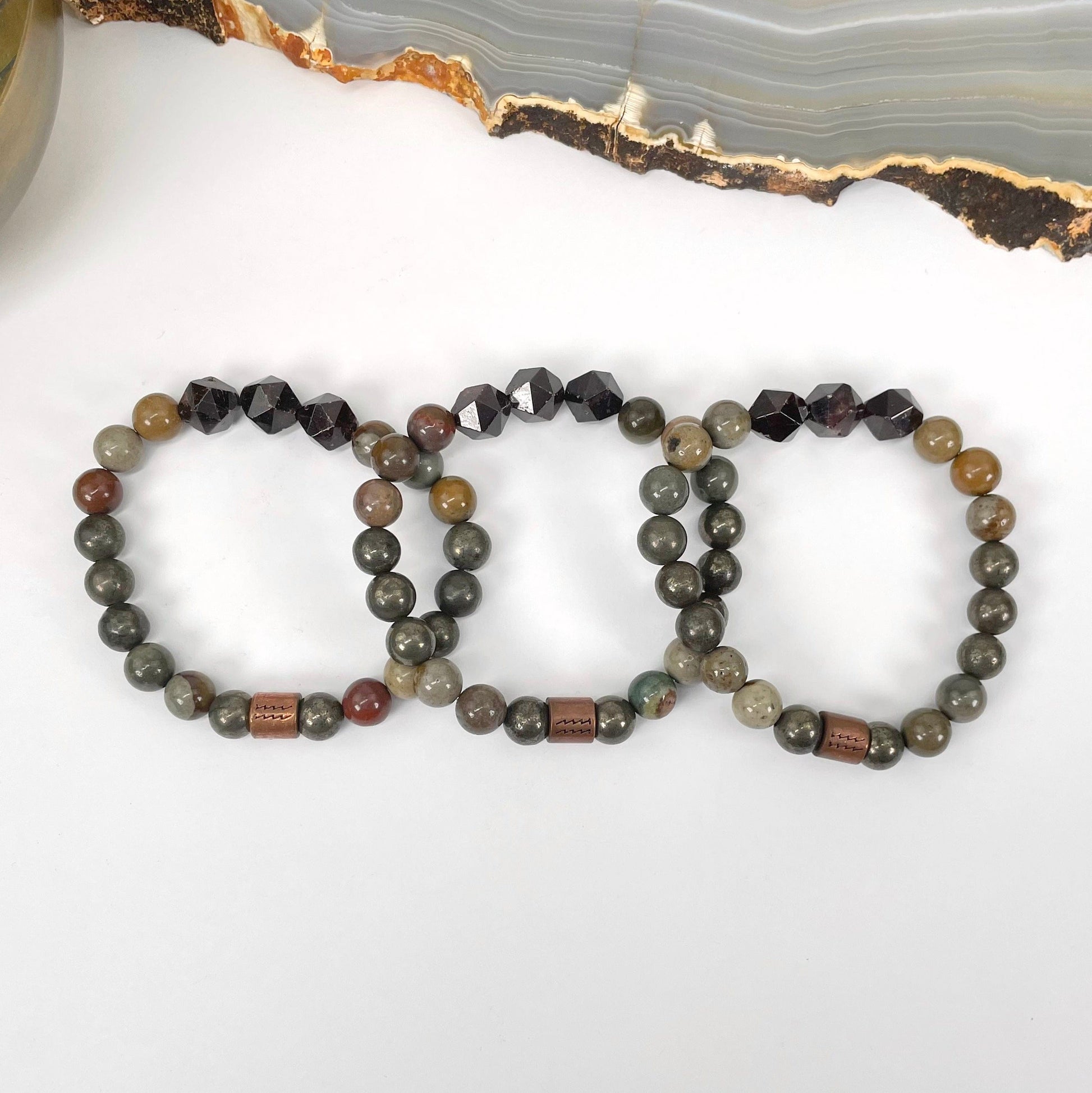 close up of aquarius zodiac bracelets for details and possible variations 