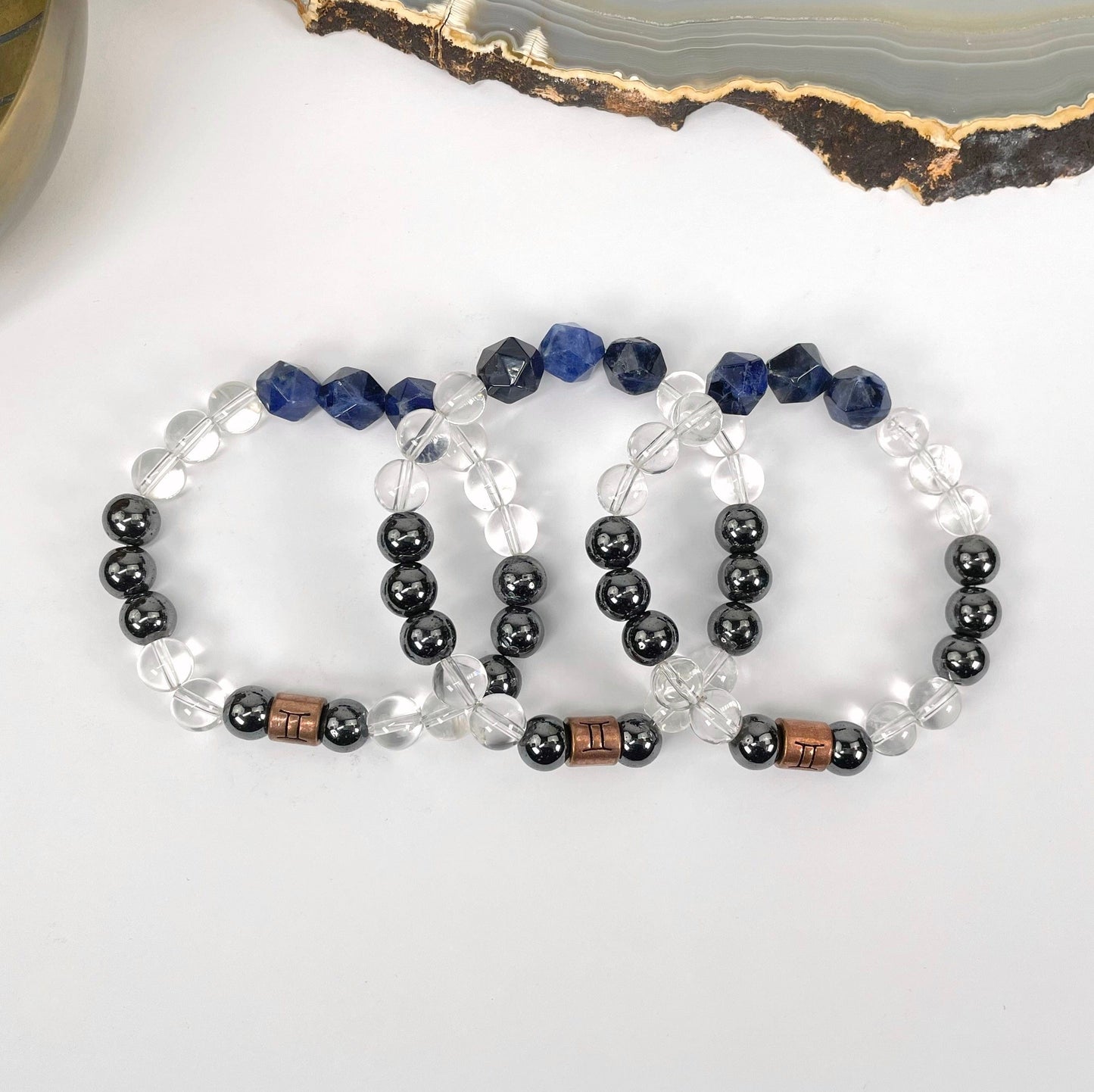 close up of gemini zodiac bracelets for details and possible variations 