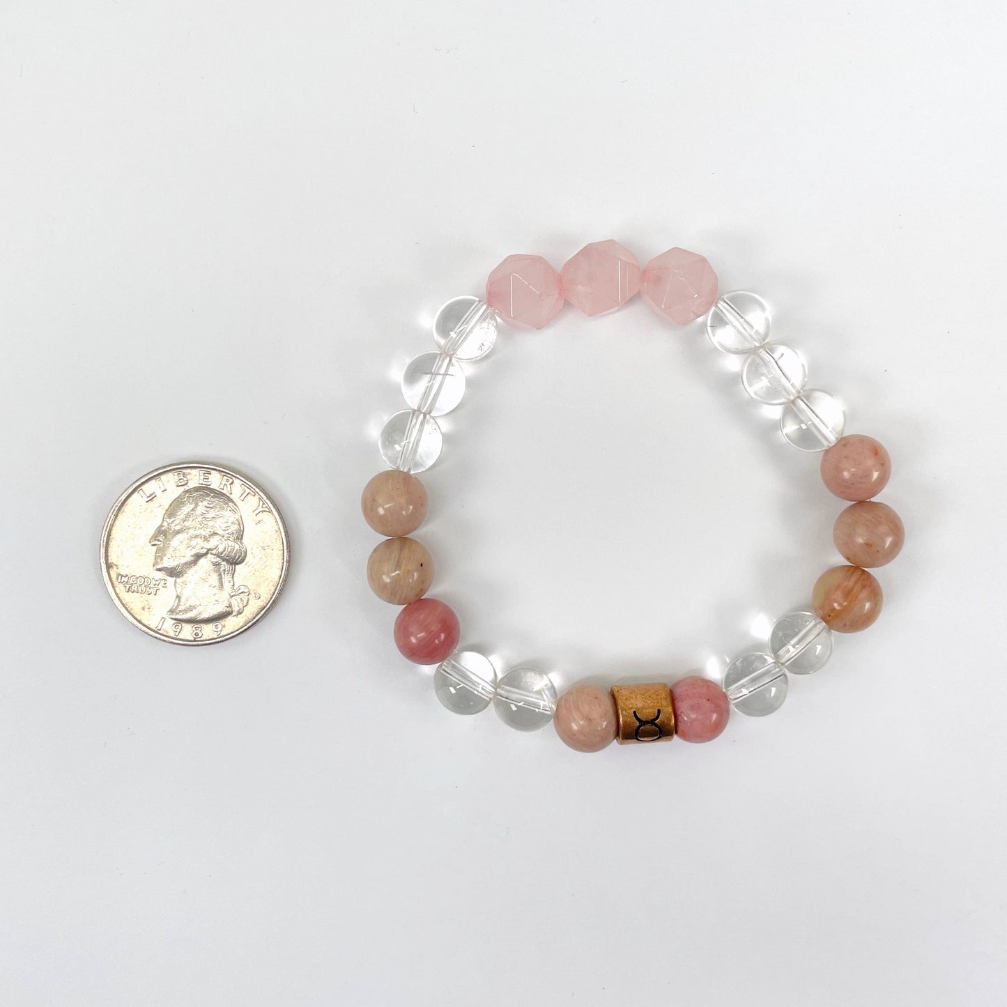 taurus zodiac bracelet with quarter for size reference