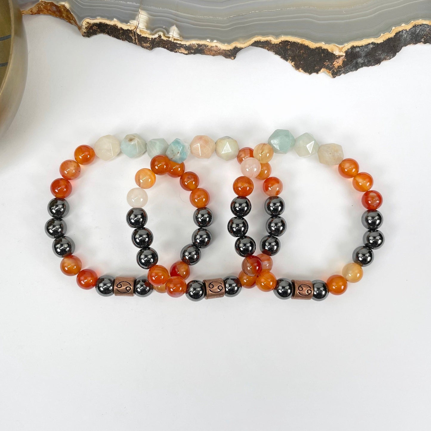 close up of cancer zodiac bracelets for details and possible variations 