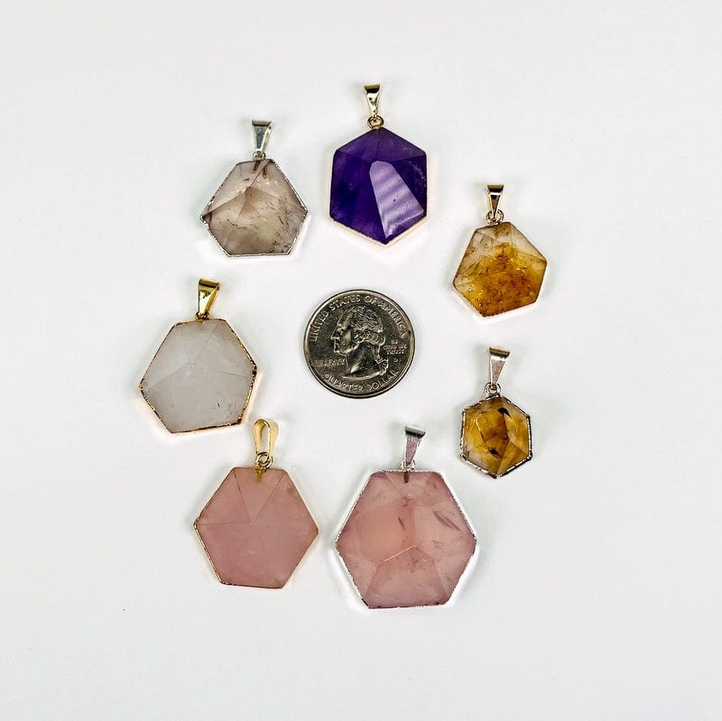 pendants next to a quarter for size reference 