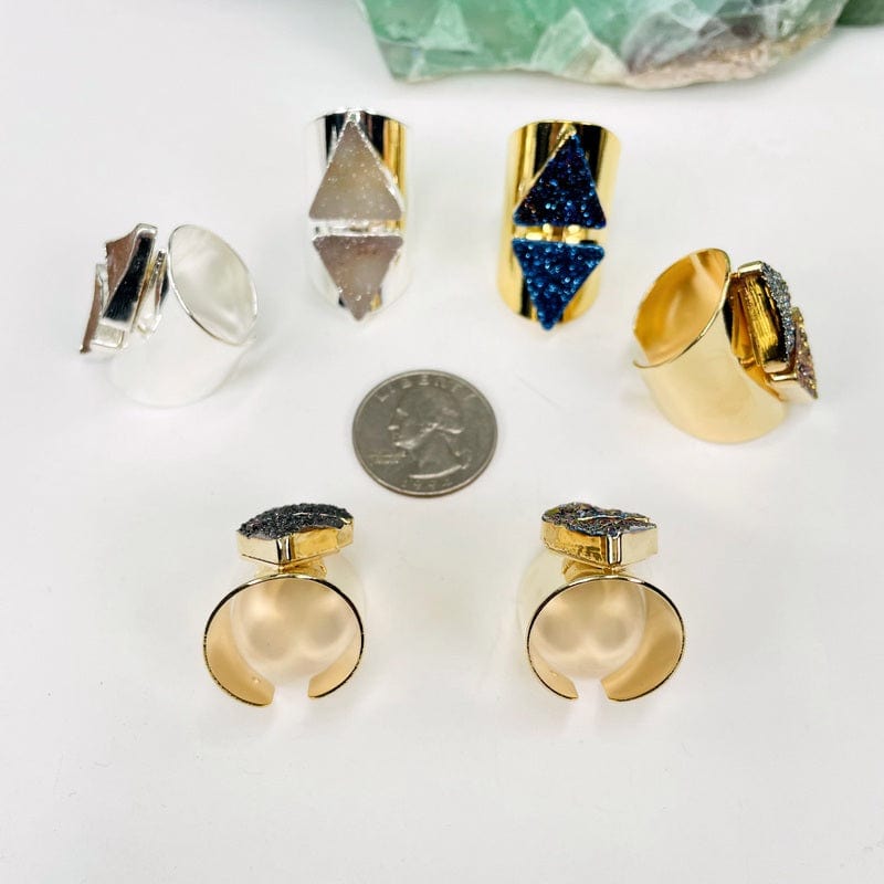 rings next to a quarter for size reference 