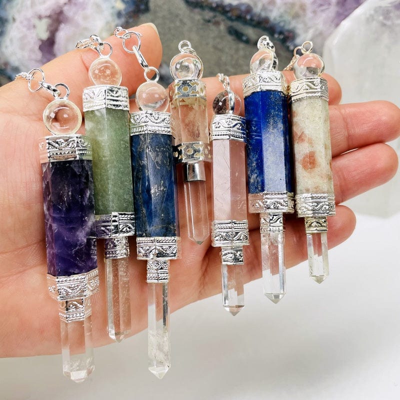 close up of the pendulums to show the details of the crystal quartz point and mini sphere 