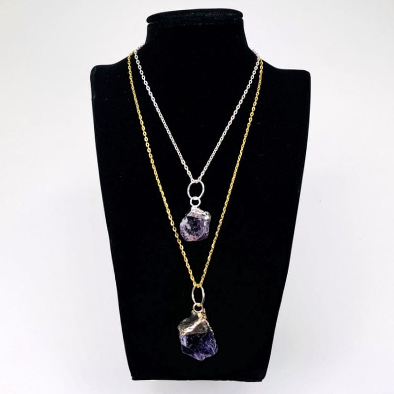 rough stone pendants displayed on a chain for reference. chain not included 