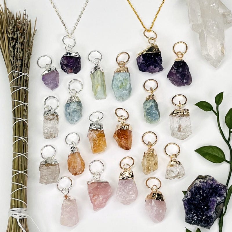 gold and silver pendants displayed to show the differences in the stone sizes and color shades 