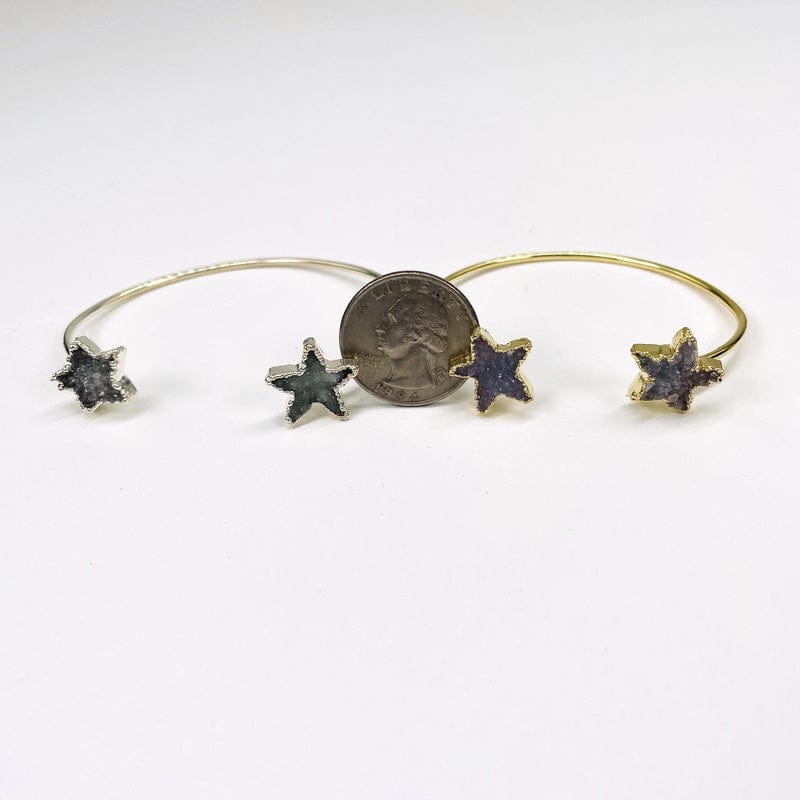dusy star next to a quarter for size reference