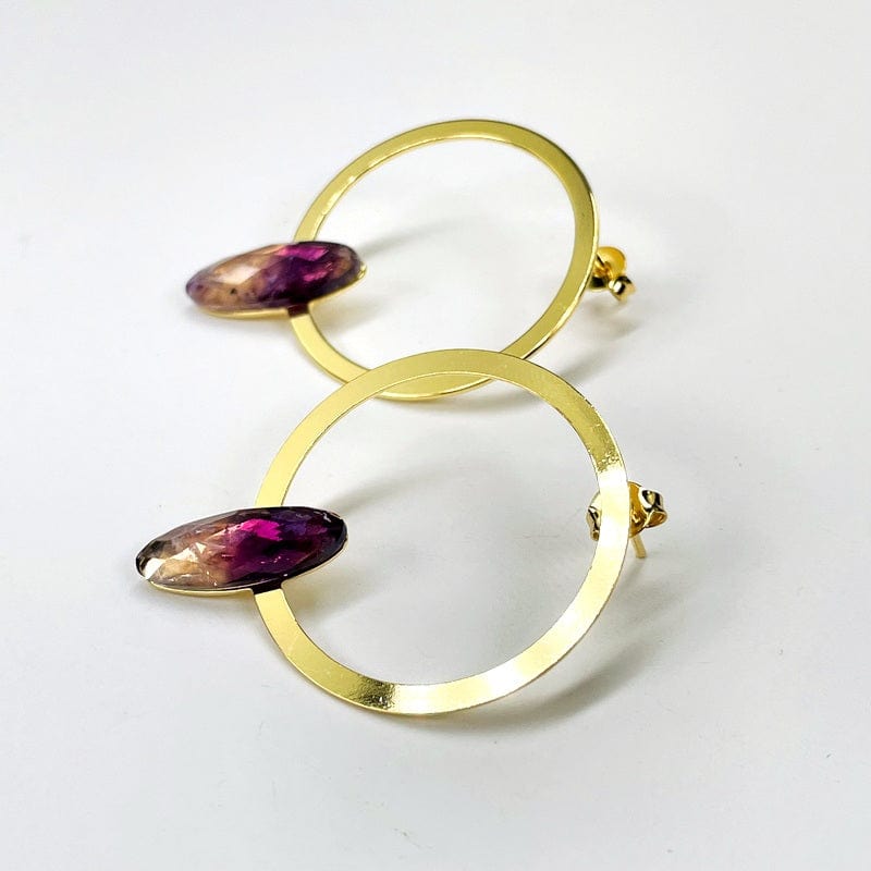 side view of the earrings showing that they are faceted 