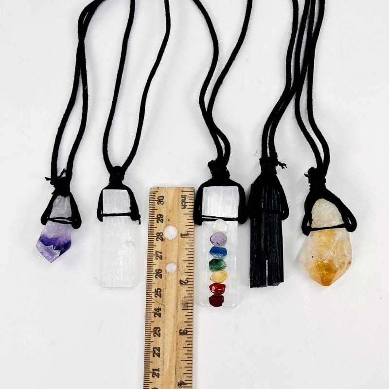 crystal clusters next to a ruler for size reference 
