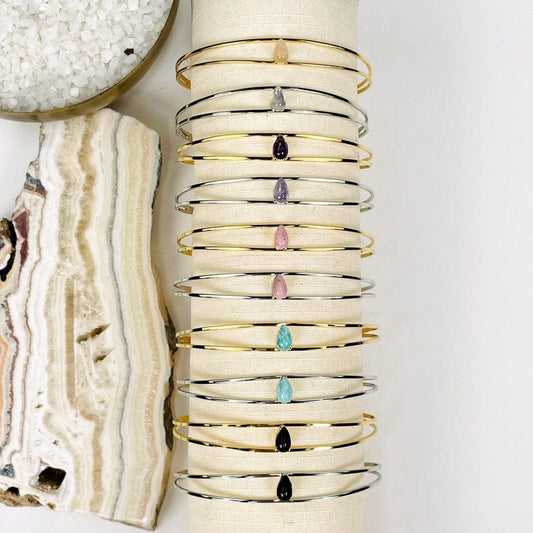 close up of the gold and silver bracelets displayed next to each other 