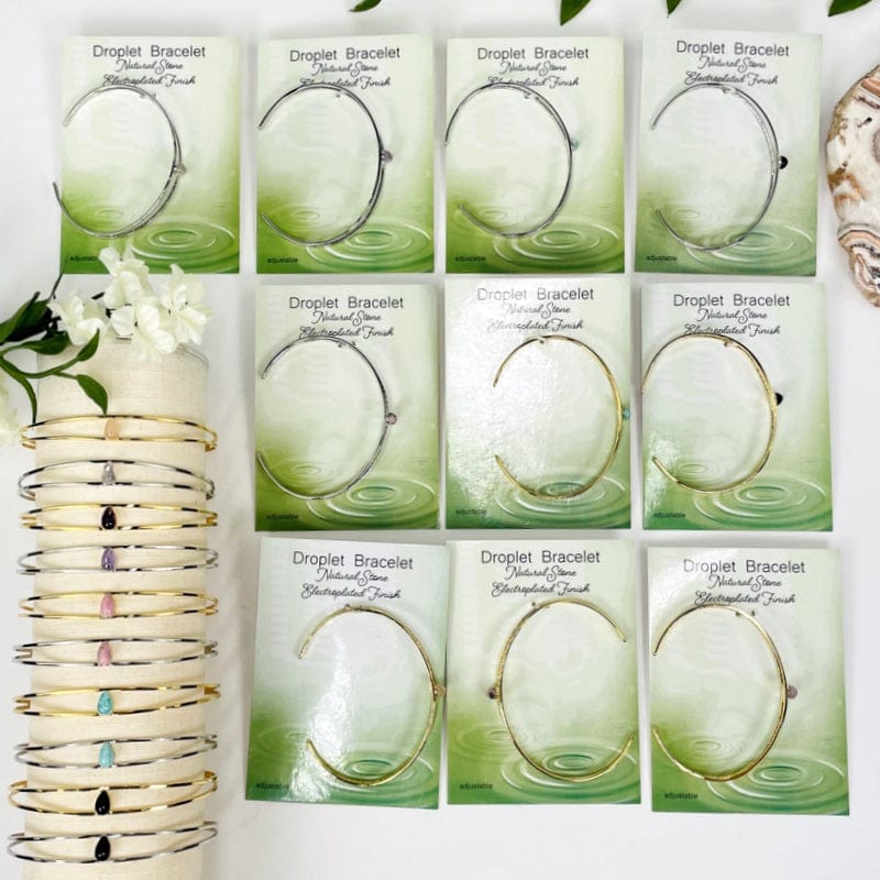 multiple droplet bracelets displayed to show the differences in the gemstone types 