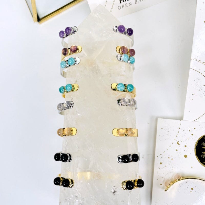 close up of the all the gemstone bracelets in gold and silver 