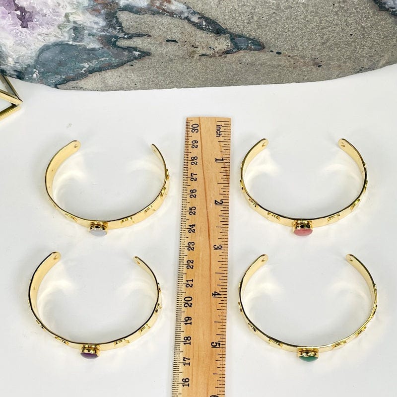 bracelets next to ruler for size reference 