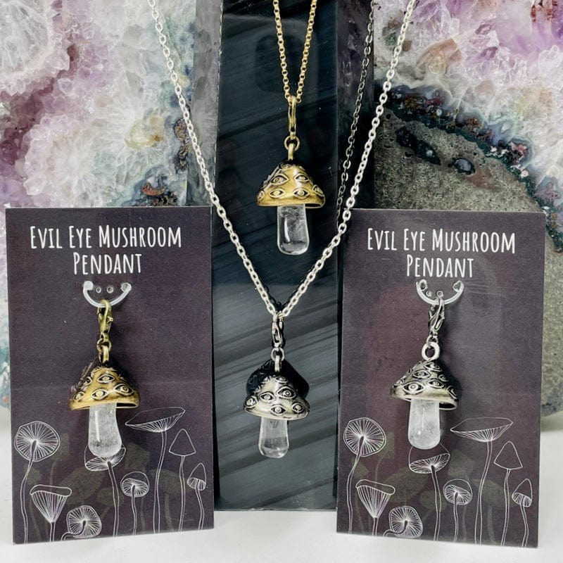 mushroom pendant with a crystal quartz stem available in antique gold or silver 