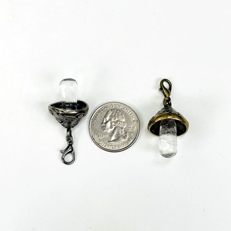 pendants next to a quarter for size reference 