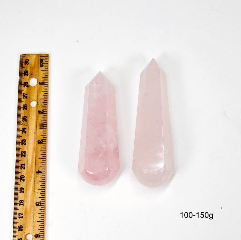 massage wand next to a ruler for size reference. showing size 100-150g