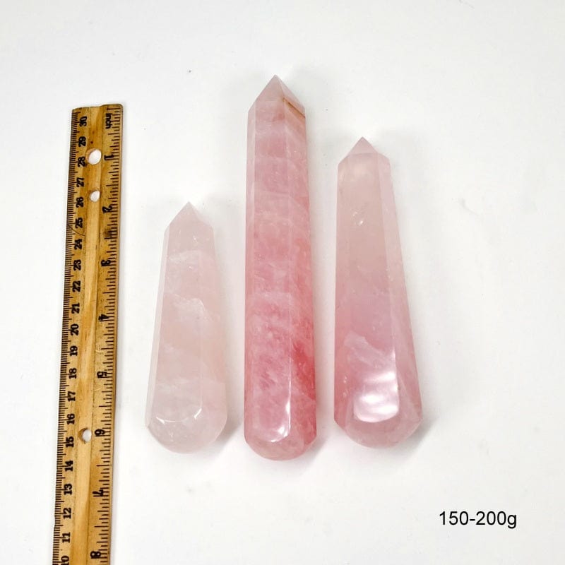 massage wand next to a ruler for size reference.  showing size 150-200g