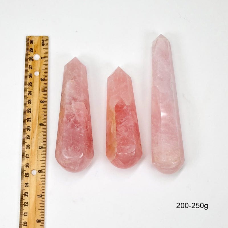 massage wand next to a ruler for size reference. showing 200-250g