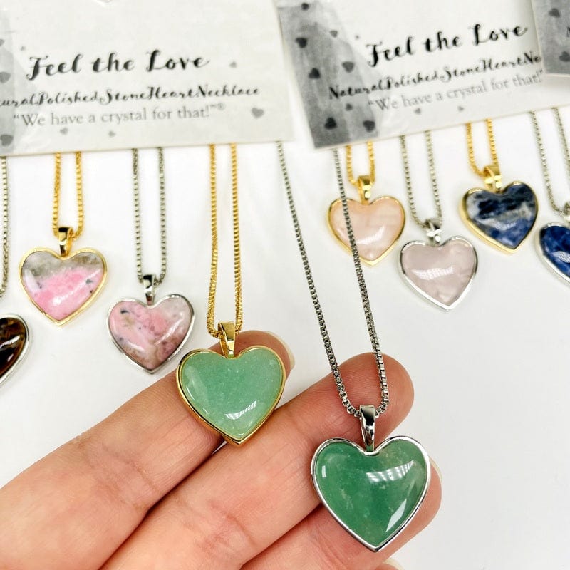 necklace pendants in hand for size reference 